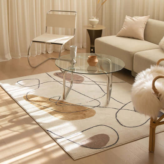 Original design character patterned rug in a cozy living room setting with a glass table and modern decor.