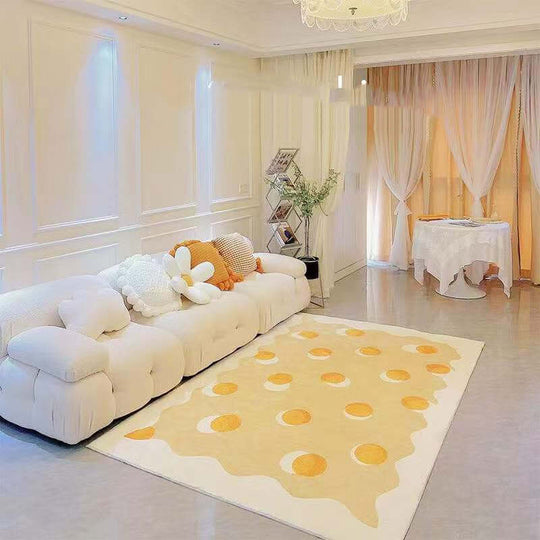 Original design rug with character pattern in egg yolk colors, enhancing a cozy living room decor.