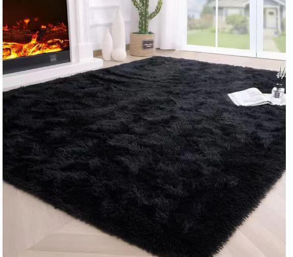 Luxurious black shag rug for living room, crafted from soft polyester, enhancing home decor and comfort.